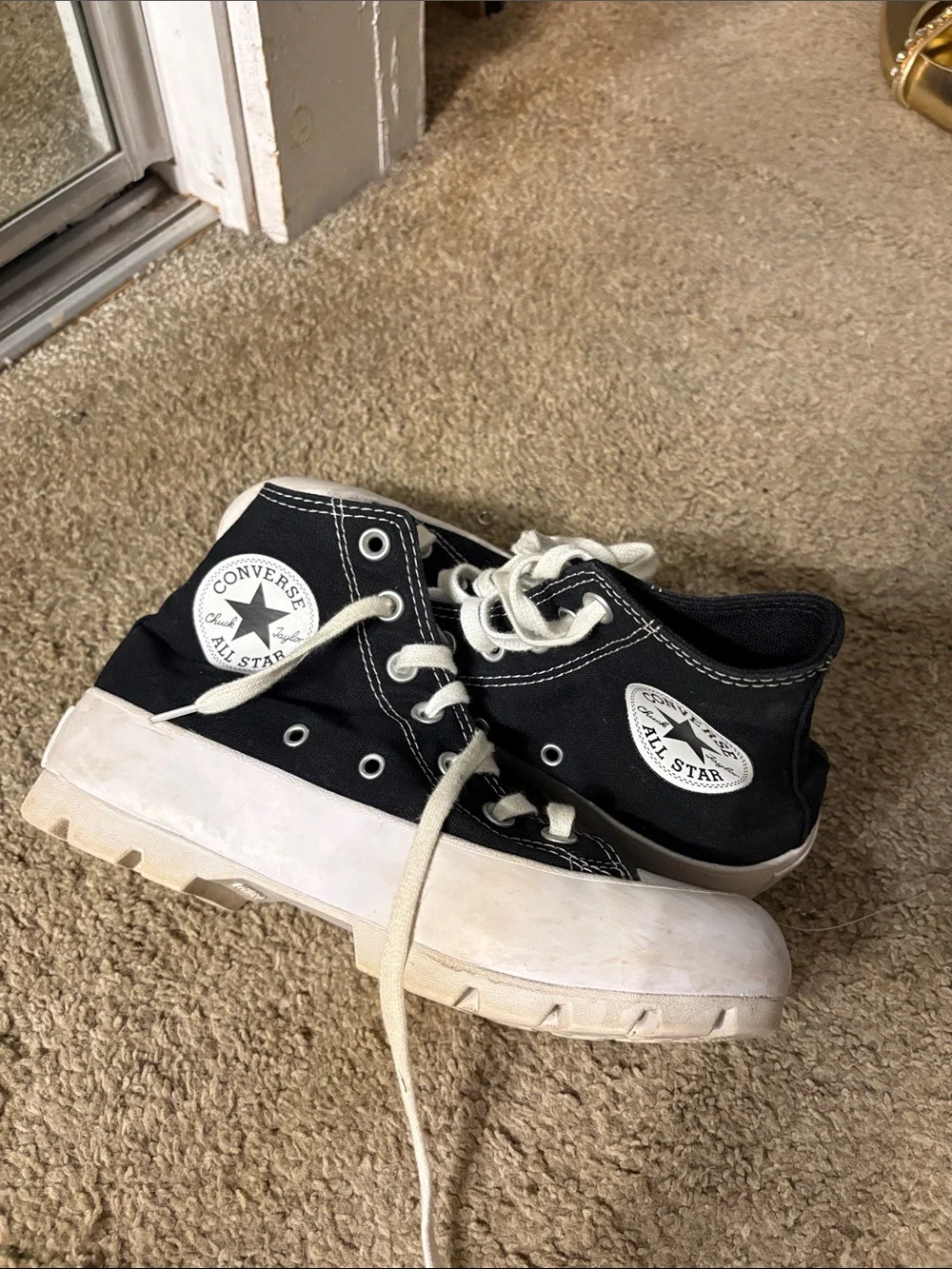 Converse women’s Black Canvas High-Top Platform Sneakers with White Soles